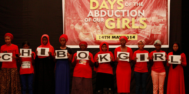 People attend a vigil to mark one month after the girls of government secondary school Chibok were kidnapped, in Abuja, Nigeria. Photo / AP