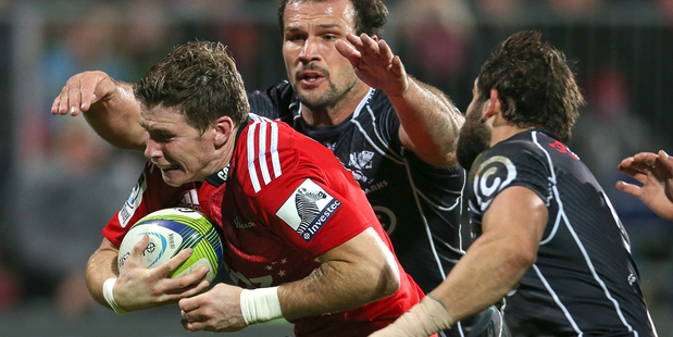 Colin Slade of the Crusaders breaks through to score a try during the round 14 Super Rugby match between the Crusaders and the Sharks. Photo / Getty Images.