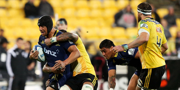 Nasi Manu of the Highlanders is tackled during the round 14 Super Rugby match between the Hurricanes and the Highlanders at Westpac Stadium. Photo / Getty Images.