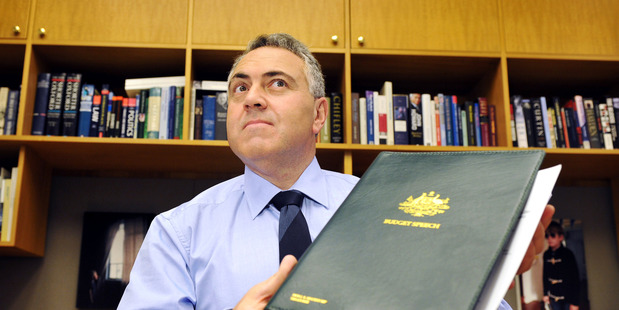 Joe Hockey, Australia's treasurer, poses for photographs ahead of his Budget. But it's a photo he didn't pose for that's gained more prominence. Photo / AP