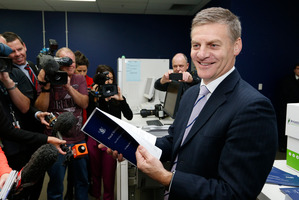 Finance Minister Bill English checking copies of his 2014 Budget. Photo / Mark Mitchell