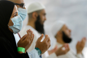 Oct. 2013, file photo of Egyptian Muslim pilgrims, some wearing masks as a precaution against the Middle East respiratory syndrome, praying at the Hajj. Photo / AP