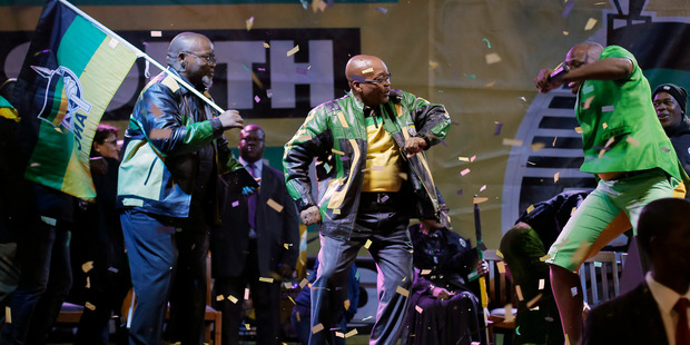 The ruling party president Jacob Zuma, center, sings and dances, at a victory party downtown Johannesburg, South Africa. Photo / AP