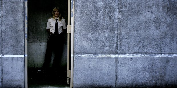 Corrections office Vanessa Sutton looks on to an exercise yard in Auckland Prison. Photo / Doug Sherring