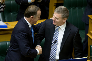 Finance Minister Bill English is congratulated by Prime Minister John Key after reading his 2014 Budget in Parliament, Wellington. Photo / Mark Mitchell