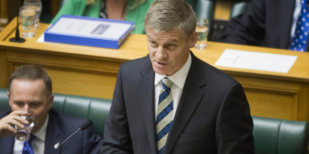 Finance Minister Bill English, with Prime Minister John Key, reading the 2013 Budget. File photo / Mark Mitchell