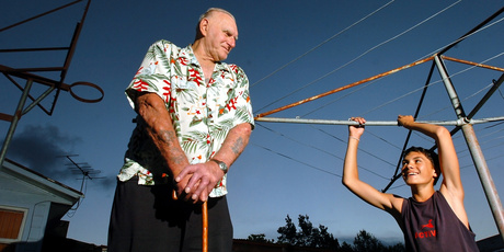Steven Adams hanging off the clothesline as a 12-year-old, with father Sid. Photo / Stephen Parker