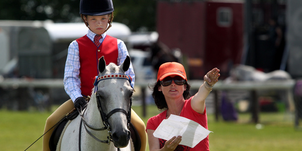 This 2012 photo shows Lisa Chittick with her daughter Charlotte, then aged 10 on 'Beechcraft Chablis'. Photo / Warren Buckland / Hawke's Bay Today