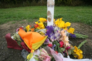 Flowers and messages left on Somerset Road near the scene of the fatal hot air balloon crash.