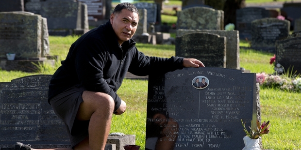 Selise Lo Tam at his grandparents' grave at Waikumete Cemetery where his father, Fritz Lo Tam, died on Mother's Day. Photo / Brett Phibbs