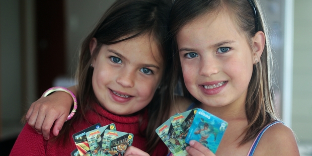 Twins Jesse and Hannah Shaw with their Countdown DreamWorks collectable cards. Photo / Doug Sherring