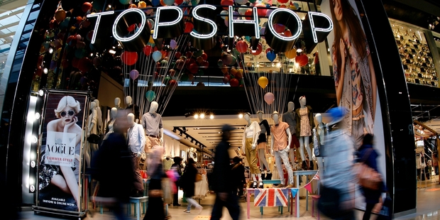Shoppers look for the latest fashion bargains at a Topshop store in Stratford, London.