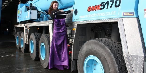 Kirsten Holmes, 17, with the crane in which she was taken to her school ball on Saturday night. Photo/Rebecca Savory