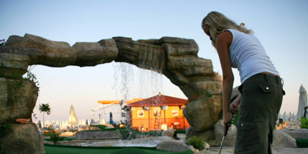 The greatest putt-putt shot of all time. A water fountain floating golf ball to hole-in-one. Photo / Thinkstock.