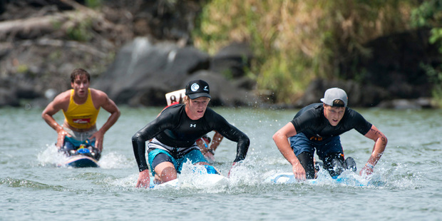 New Zealand's Sam Shergold (front left) makes a break with Australia's Rhys Burrows in the 18km prone paddle board race. Photo by Michael Tweedle/ISA
