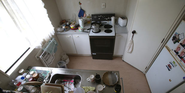 A woman was found trapped under her oven by a friend that heard her yells for help. Photo / John Borren