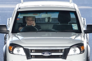 The Herald watched motorway traffic between 11.40am and 12.40pm on Thursday, and caught 49 drivers distracted by their phones. Photos / Richard Robinson