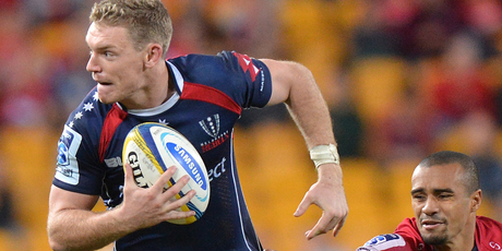 Rebels fly-half Bryce Hegarty attempts to evade Will Genia. Photo / Getty Images.
