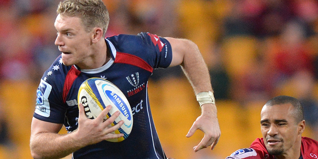 Rebels fly-half Bryce Hegarty attempts to evade Will Genia. Photo / Getty Images.