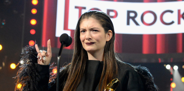 Lorde looks confused as she wins Top Rock Song at the Billboard Music Awards for Royals. Photo/Getty
