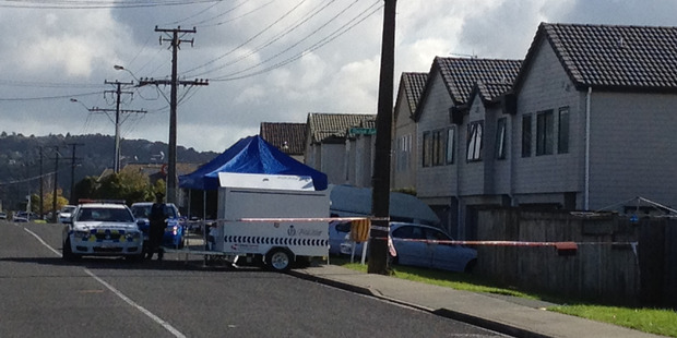 Police attend to the scene at a house in Pooks Rd Ranui where the bodies of two deceased women were found. Photo / Brett Phibbs