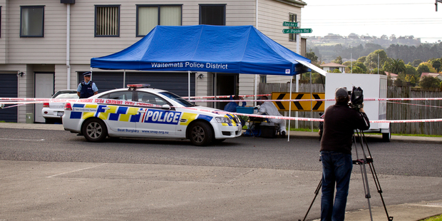 Police at the scene of the death of a mother and daughter in a West Auckland house. Photo / Dean Purcell.
