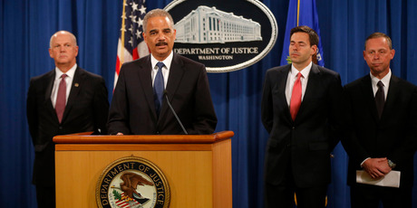 Attorney General Eric Holder, accompanied by, from left, U.S. Attorney for Western District of Pennsylvania David Hickton, Assistant Attorney General for National Security John Carlin, and FBI Executive Associate Director Robert Anderson, speaks at a news conference at the Justice Department. Photo / AP