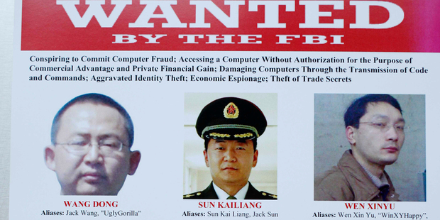 Wanted posters released by the US Government, when announcing criminal charges against top Chinese military officers. Photo / AP