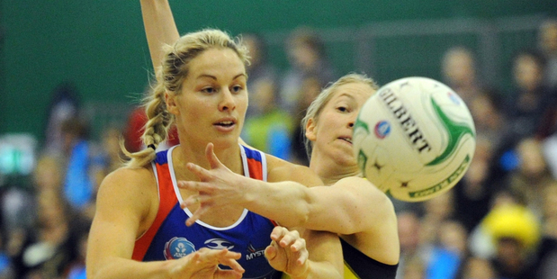 Mystics' Julie Corletto, left, contests the ball with Pulse's Camilla Lees. Photo: SNPA / Ross Setford