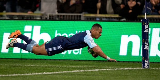 Blues winger Tevita Li scores his second-half try during last night's game against the Sharks. Photo / Richard Robinson