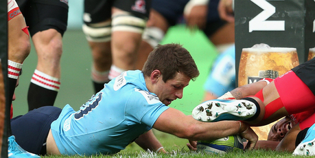 Bernard Foley scores the opening try in the Waratahs's win over the Lions. Photo / Getty Images