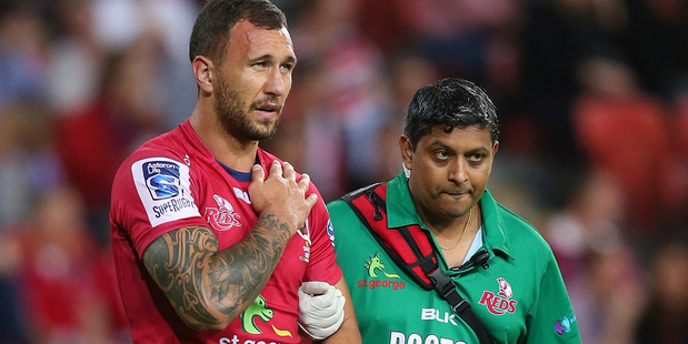 Quade Cooper of the Reds leaves the field against the Rebels. Photo / Getty Images