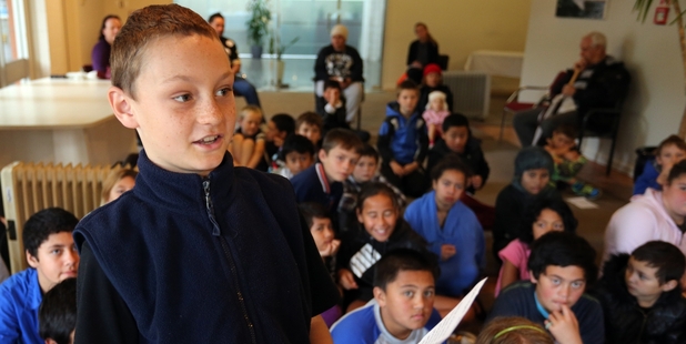 ALL EARS: Khan Robinson reads his letter during the school's Raumanga Stream presentation to Whangarei Mayor Sheryl Mai. PHOTOS/JOHN STONE