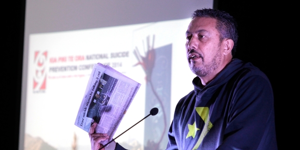 Mike King addresses the National Suicide Prevention Conference in Wanganui, making his point with a copy of Thursday's Chronicle and its coverage of the conference. Photo/Bevan Conley