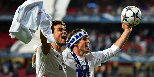 Pepe of Real Madrid and Gareth Bale of Real Madrid celebrate victory in the UEFA Champions League Final between Real Madrid and Atletico de Madrid at Estadio da Luz. Photo / Getty Images
