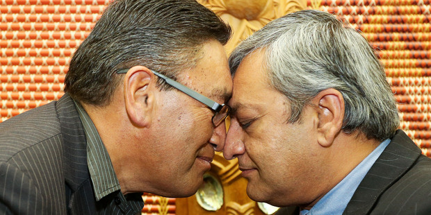 Mana leader Hone Harawira (left) and Internet Party chief executive Vikram Kumar perform a hongi after signing an alliance agreement. Photo / Getty Images