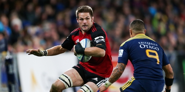 Richie McCaw of the Crusaders runs into Aaron Smith of the Highlanders. Photo / Getty Images