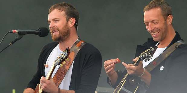 Kings of Leon's Caleb Followill performs with Chris Martin during Radio 1's Big Weekend in Glasgow. Photo/AP