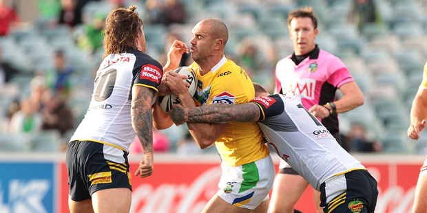 Dane Tilse of the Raiders is tackled during the round 11 NRL match between the Canberra Raiders and the North Queensland Cowboys at GIO Stadium. Photo / Getty Images.