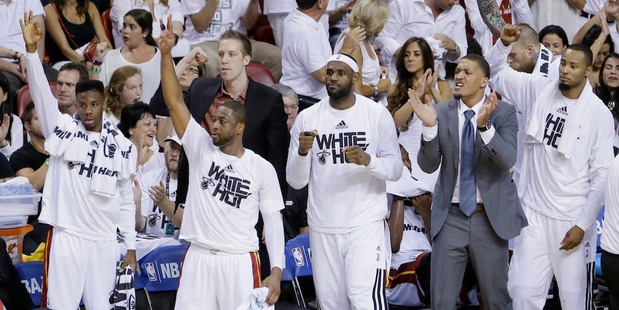 Miami Heat players Norris Cole, left, Dwyane Wade, LeBron James, Michael Beasley and Rashard Lewis cheer during the final seconds in Game 6. Photo / AP