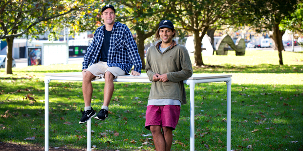 Furniture designers George Wilkins and William McCallum, of George and Willy, photographed with one of their latest products, a white bar leaner. Picture / Babiche Martens