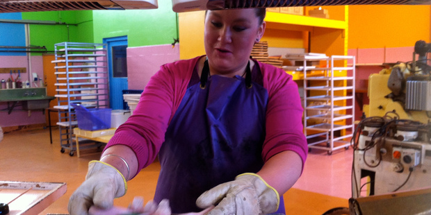 Twisting sugar to make lollipops at the Candylands factory near Gordonton.