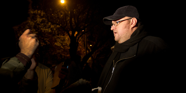 Kim Dotcom speaking to the media after a candlelight vigil at the home of Prime Minister John Key in Parnell. Photo / Sarah Ivey