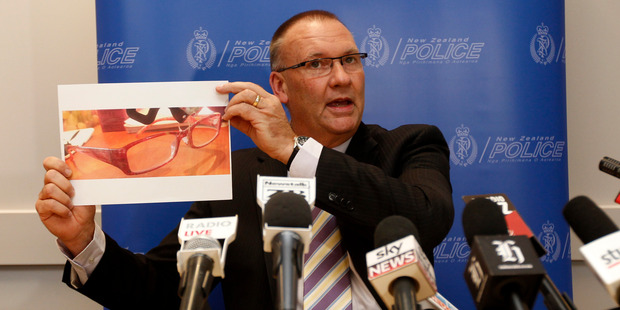 Detective Senior Sergeant Stan Brown holding a picture of glasses believed to be in the possession of Blesilda Gotingco, who went missing in the Auckland suburb of Birkdale. Photo / Chris Gorman
