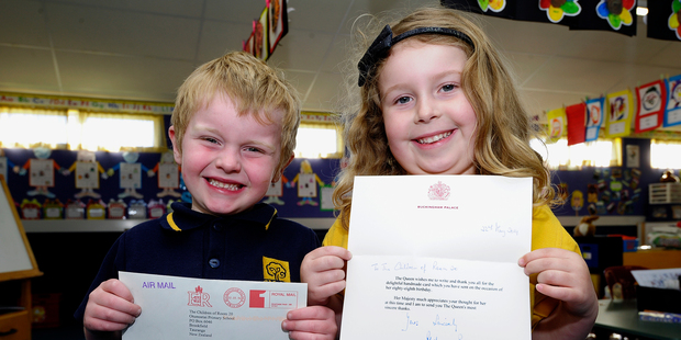 Dion Waddicor, 5 and Clara Holmes, 5, with the letter received from Buckingham Palace.Photo/George Novak