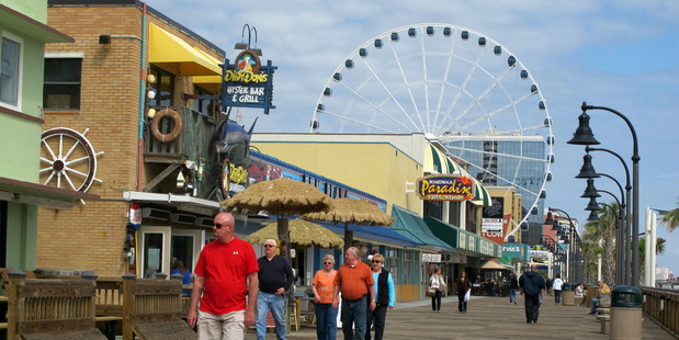 Visitors walk along the boardwalk in Myrtle Beach, South Caroline. Photo / AP