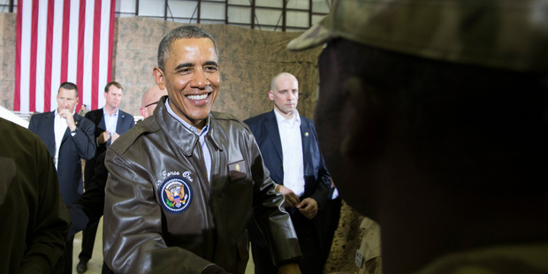 President Barack Obama shakes hands during a troop rally at Bagram Air Field, north of Kabul. The station chief's name was accidentally sent to thousands of journalists. Photo / AP