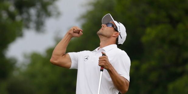 Adam Scott celebrates after sinking the winning putt on the 18th hole during the third playoff in the final round of the PGA Colonial golf tournament in Fort Worth, Texas. Photo / AP