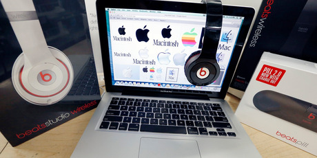 Beats Audio equipment shown next to an Apple laptop at Best Buy in Boston. Apple is buying Beats for $3b. Photo / AP
