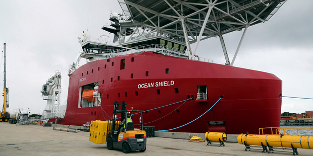 Australian vessel Ocean Shield docks while being fitted with an autonomous underwater vehicle used in the search. Photo / AP